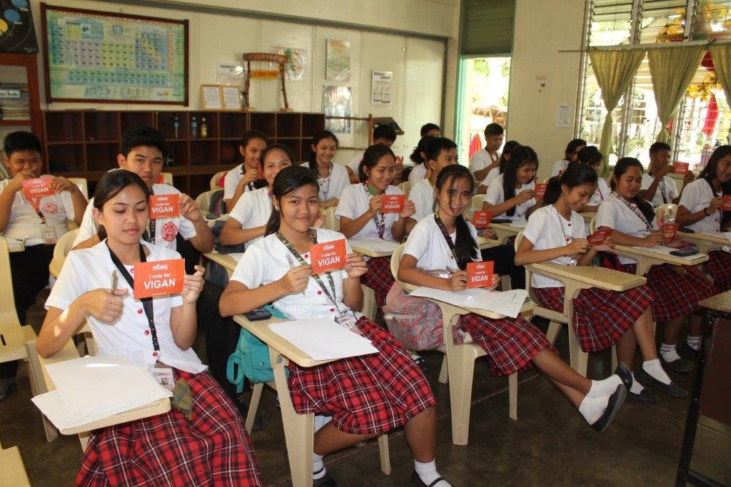 These cheerful school children in Vigan, the Philippines, have filled out their voting postcards.